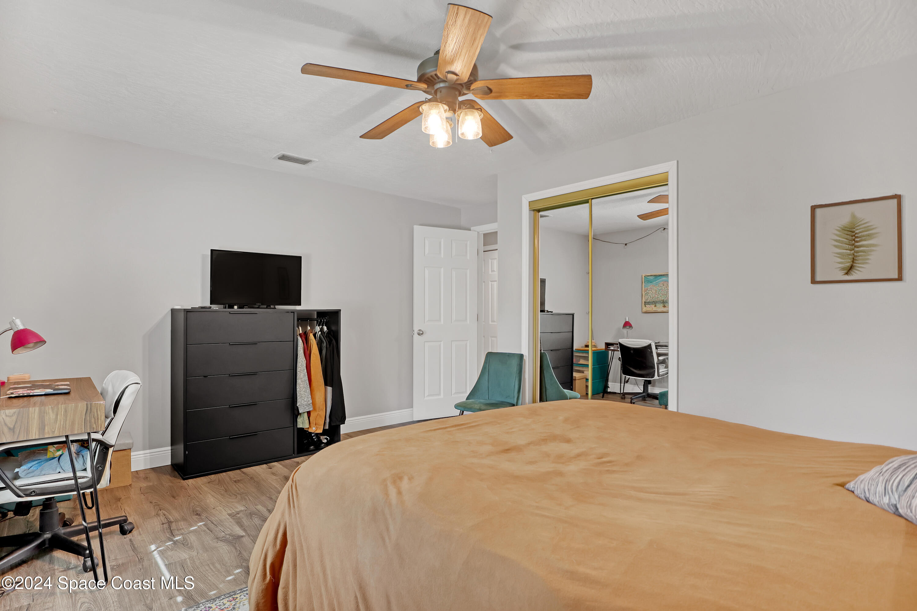 3865 Corey Road Malabar, FL 32950 - Photo 36 of 72 a bed room with a bed and a television