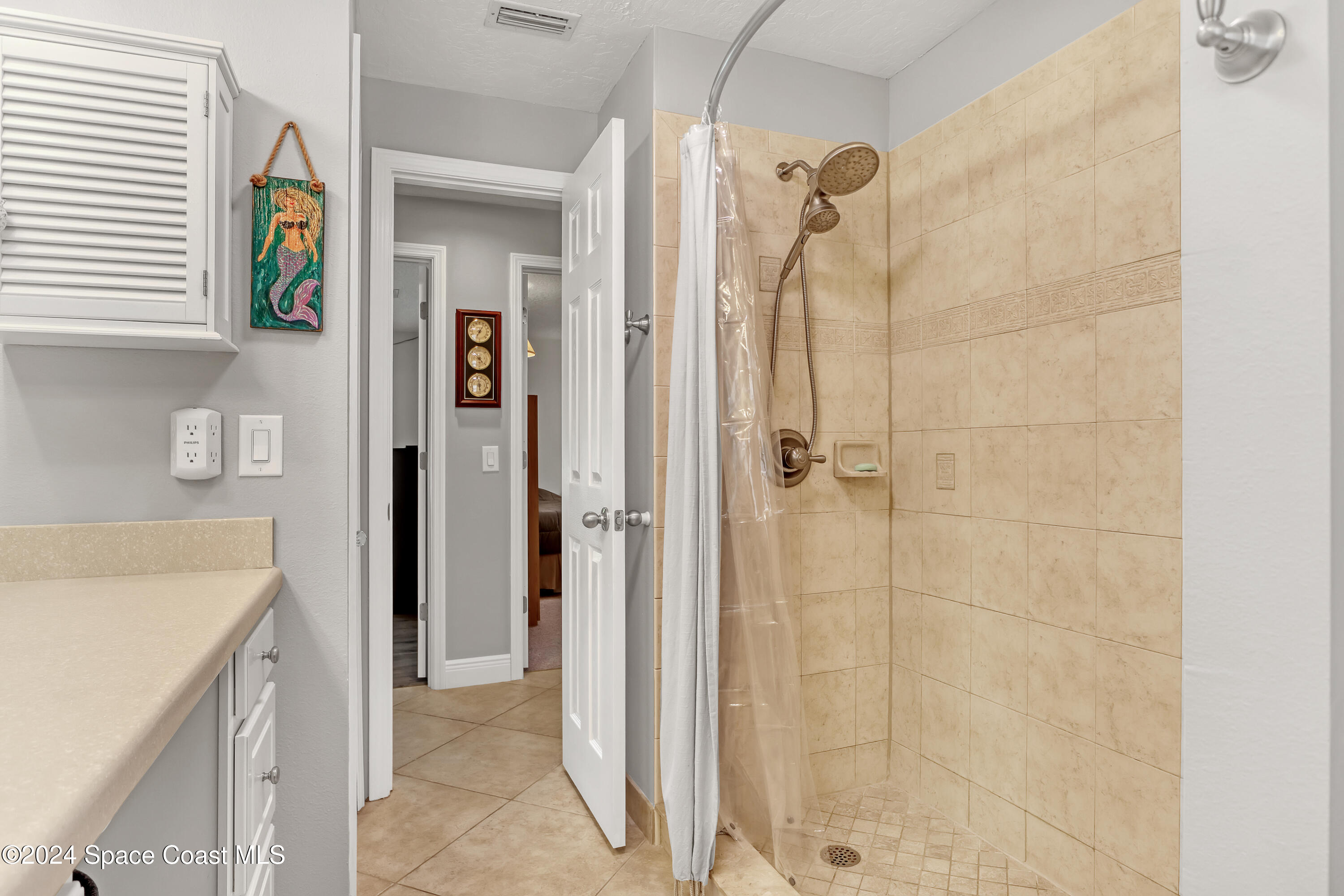 3865 Corey Road Malabar, FL 32950 - Photo 40 of 72 a bathroom with a shower
