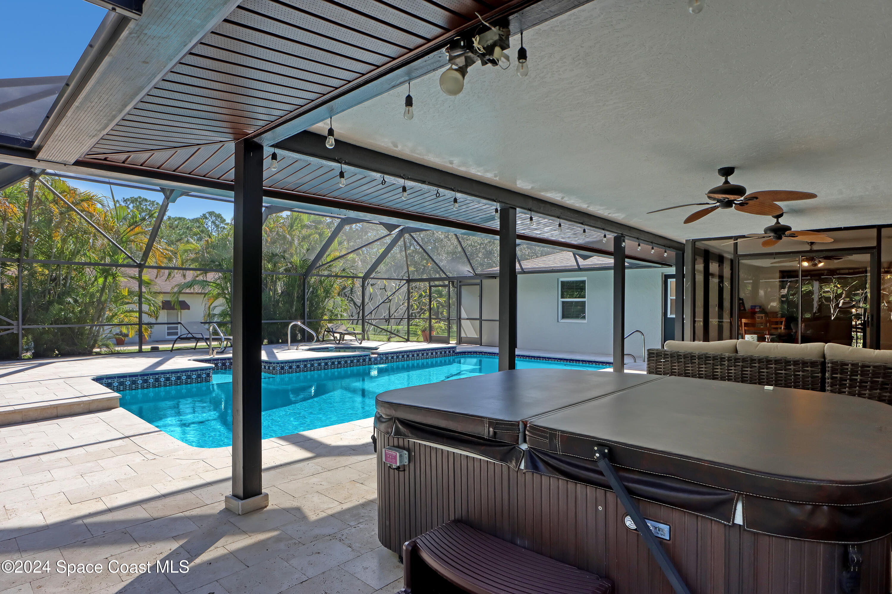 3865 Corey Road Malabar, FL 32950 - Photo 42 of 72 a view of a house with a swimming pool