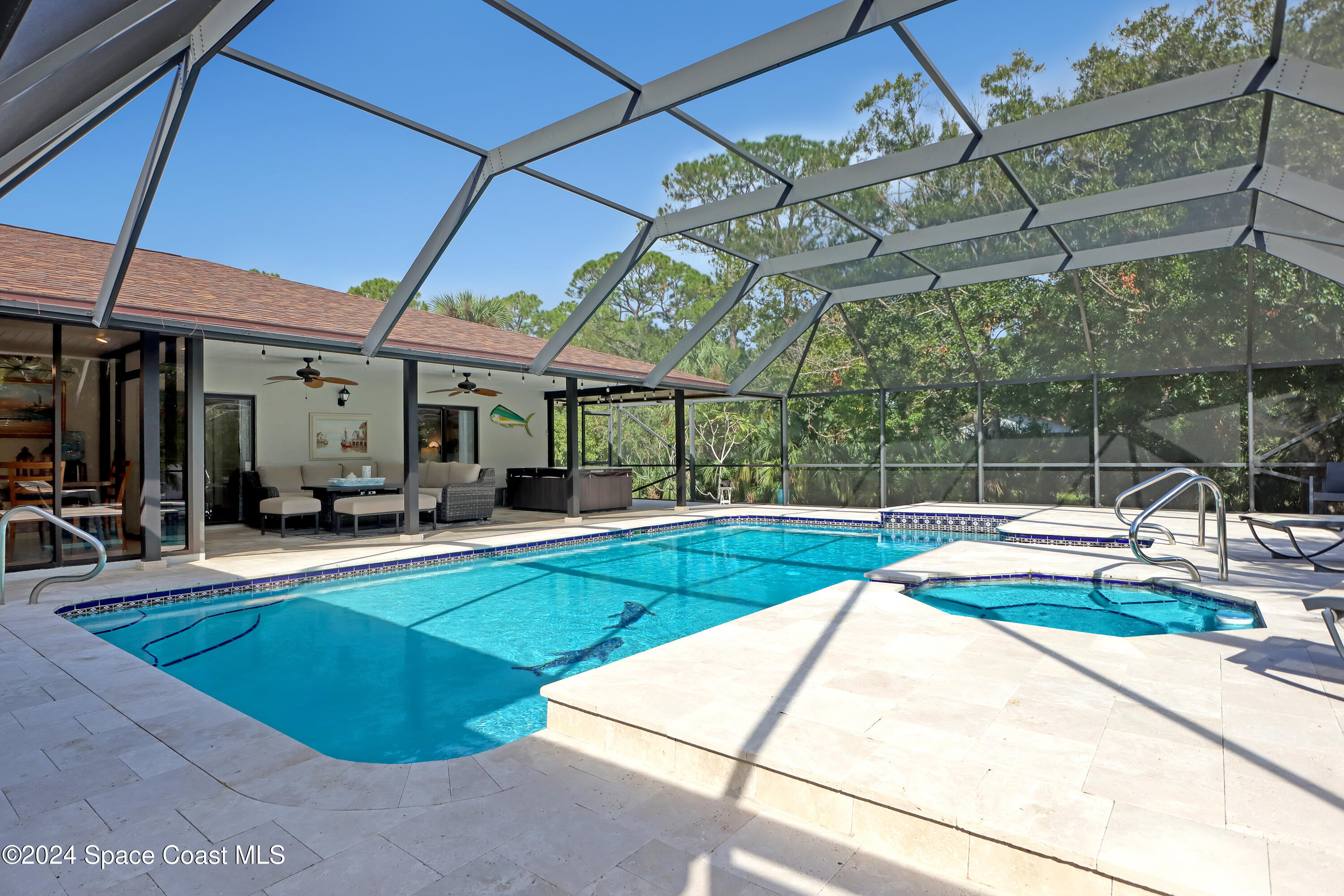 3865 Corey Road Malabar, FL 32950 - Photo 44 of 72 a view of a backyard with a patio and swimming pool