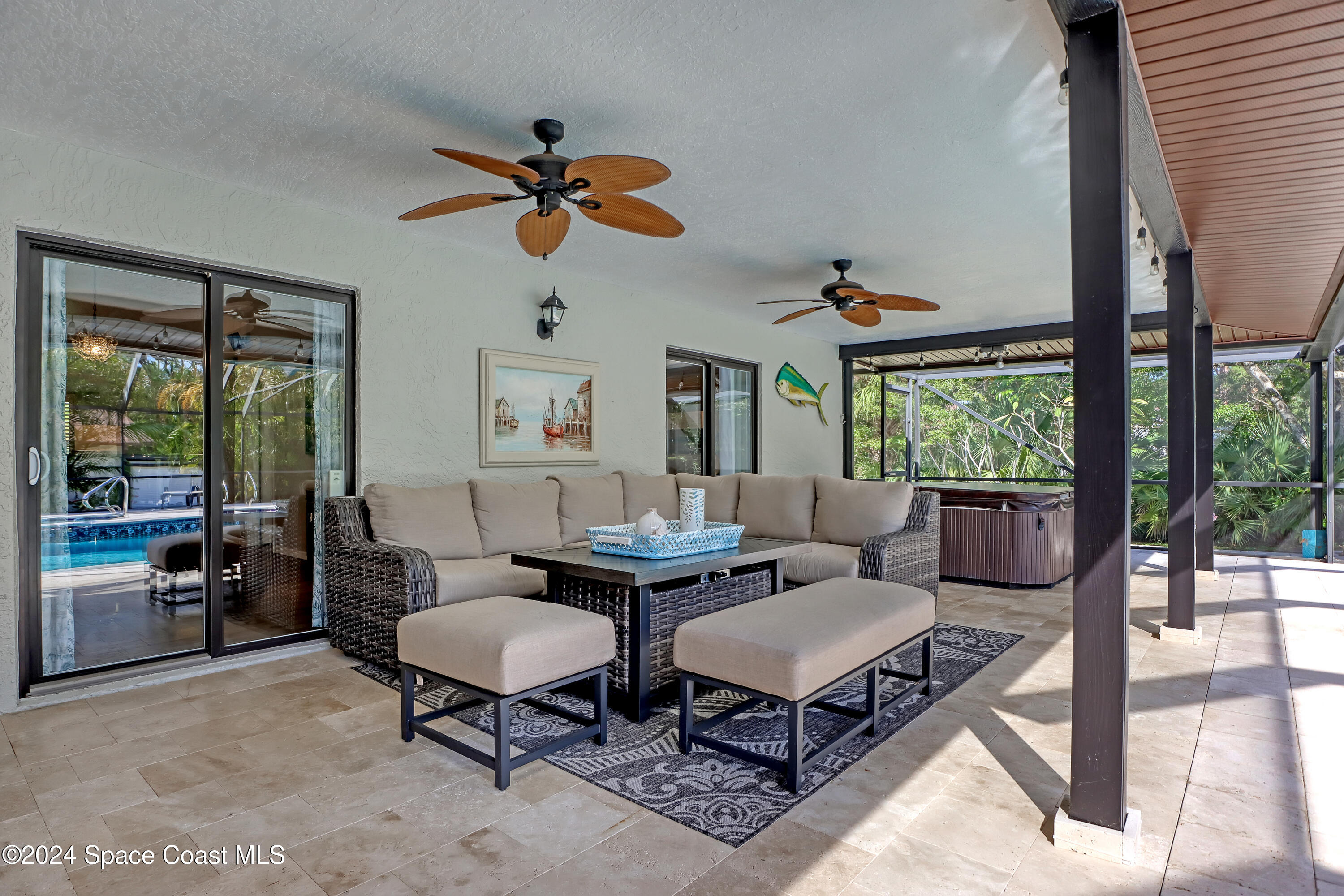 3865 Corey Road Malabar, FL 32950 - Photo 46 of 72 a living room with furniture a rug and a floor to ceiling window