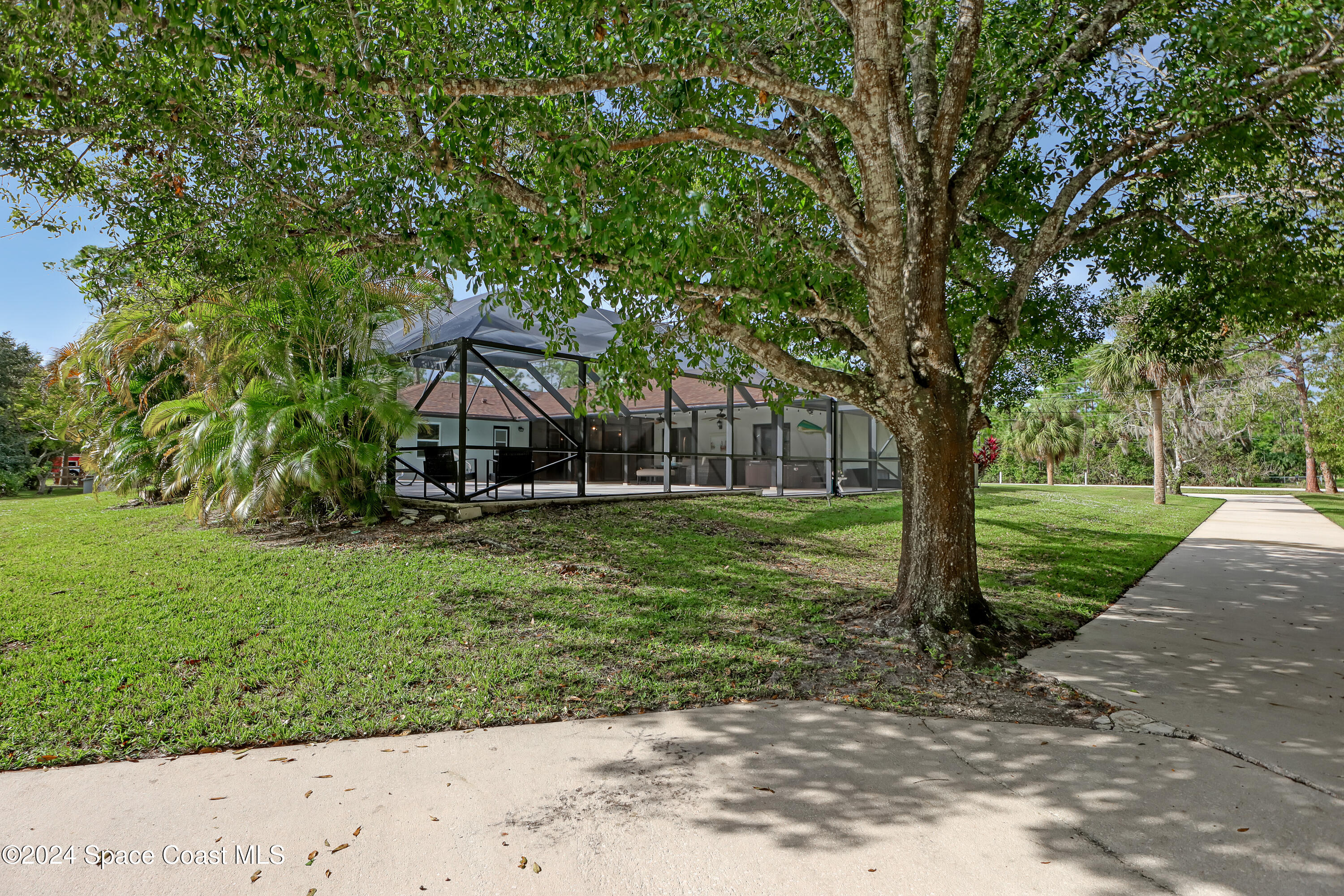 3865 Corey Road Malabar, FL 32950 - Photo 47 of 72 a front view of a house with a yard