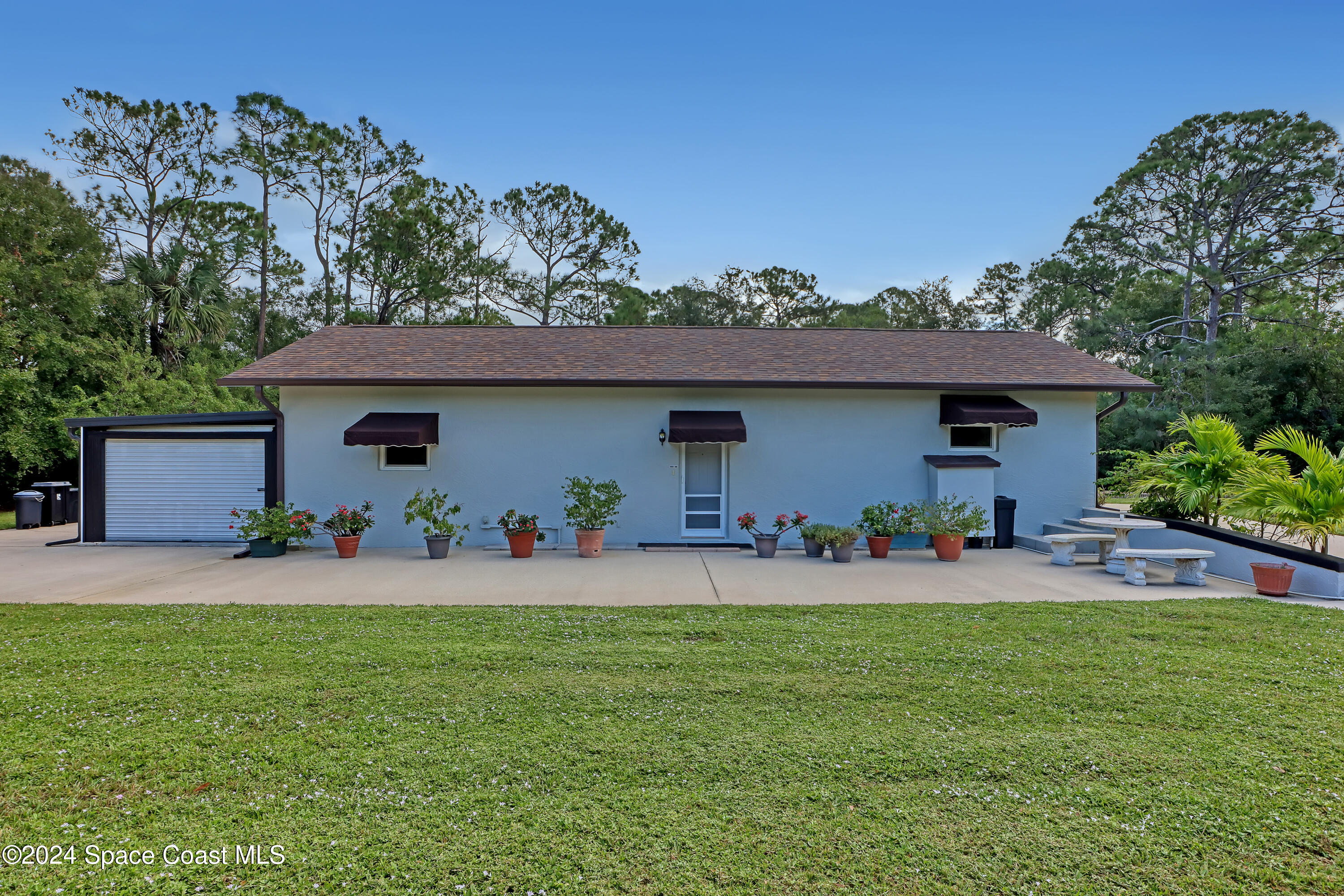3865 Corey Road Malabar, FL 32950 - Photo 5 of 72 a front view of a house with a yard