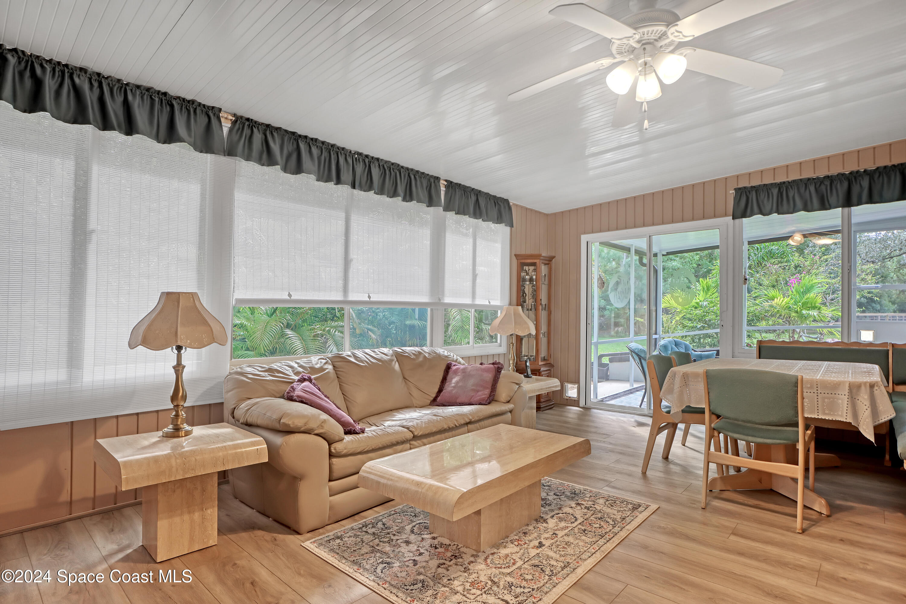 3865 Corey Road Malabar, FL 32950 - Photo 57 of 72 a living room with furniture and a large window