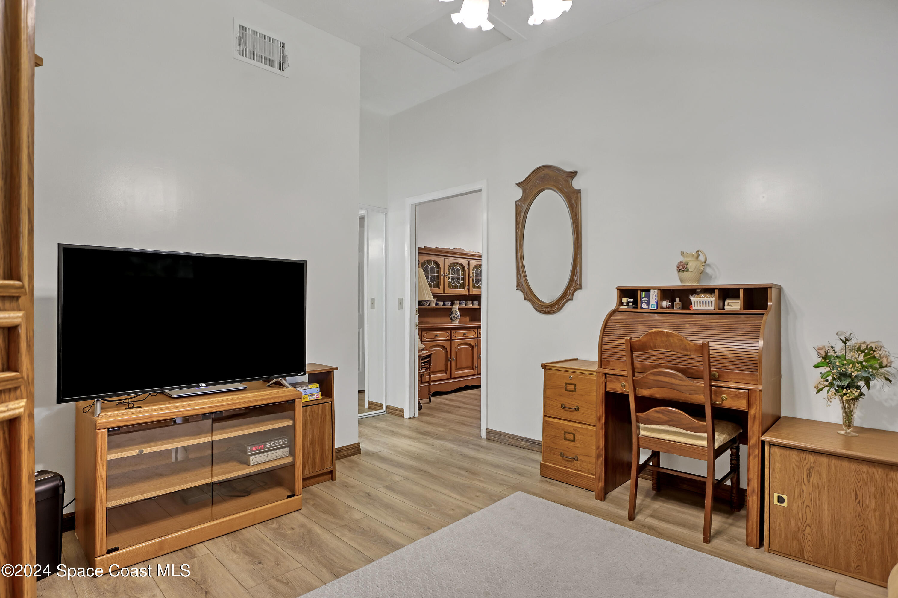 3865 Corey Road Malabar, FL 32950 - Photo 60 of 72 a living room with furniture and a flat screen tv