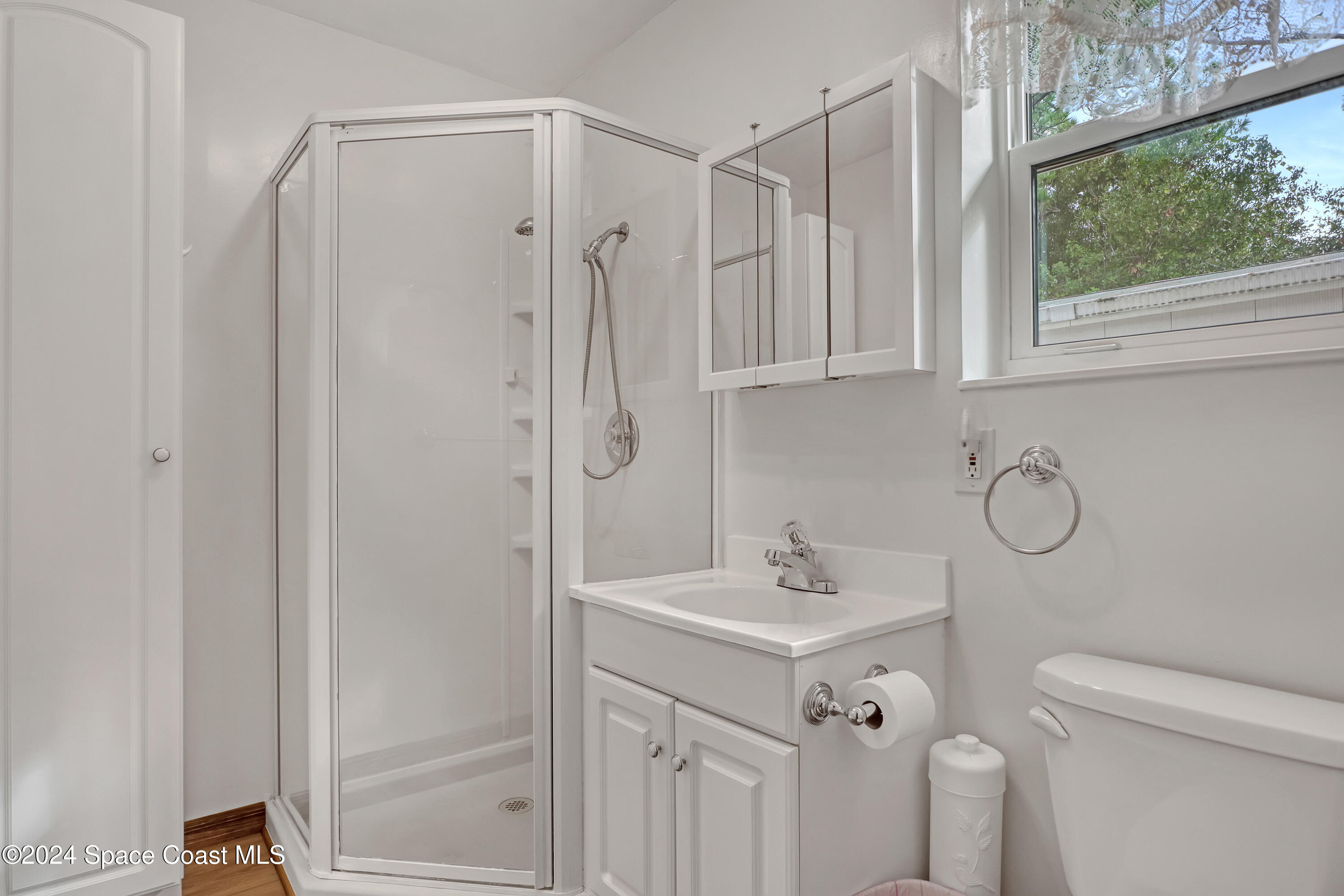 3865 Corey Road Malabar, FL 32950 - Photo 61 of 72 a bathroom with a sink a toilet and a shower