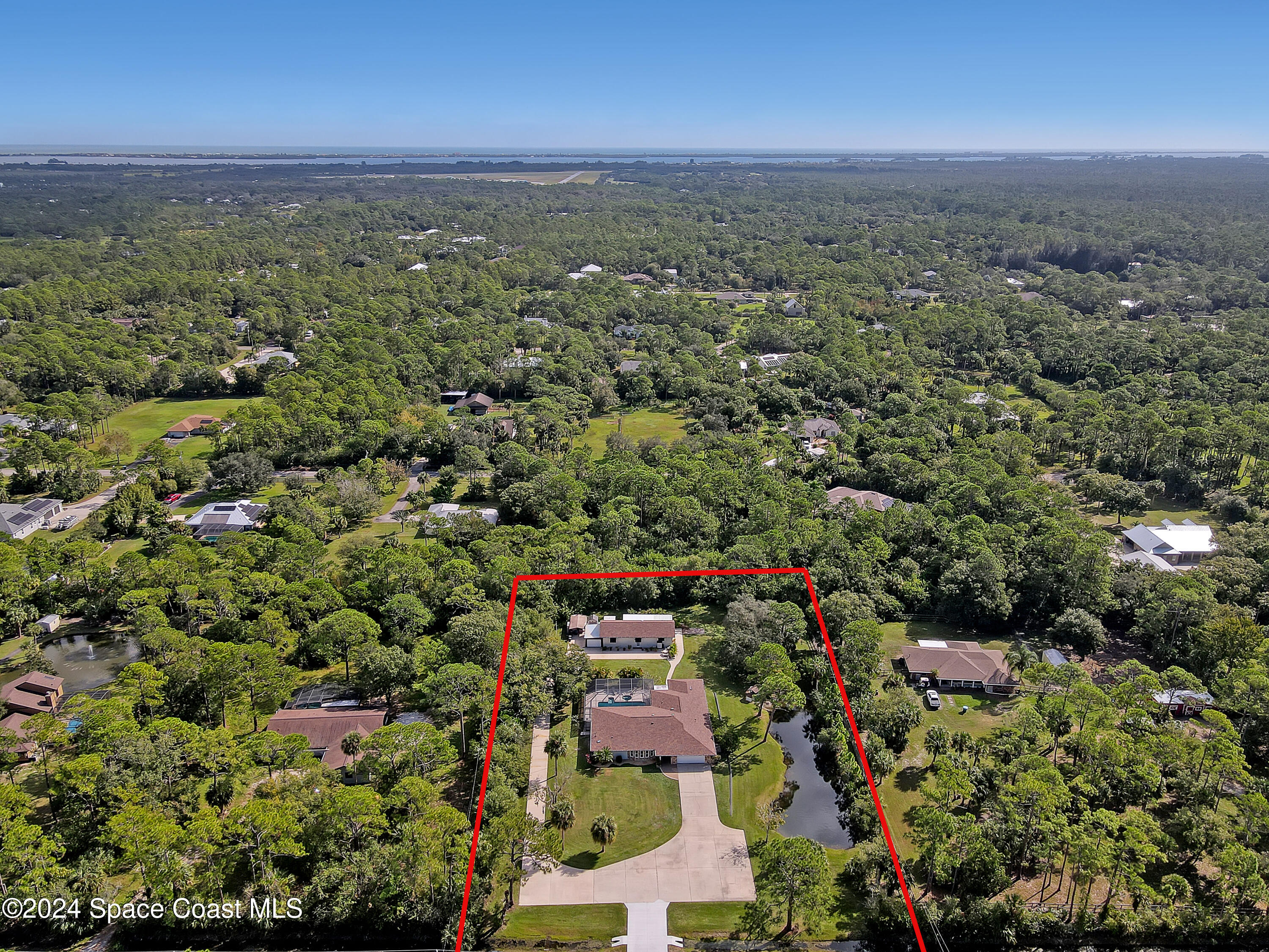3865 Corey Road Malabar, FL 32950 - Photo 71 of 72 an aerial view of a city with lots of residential buildings