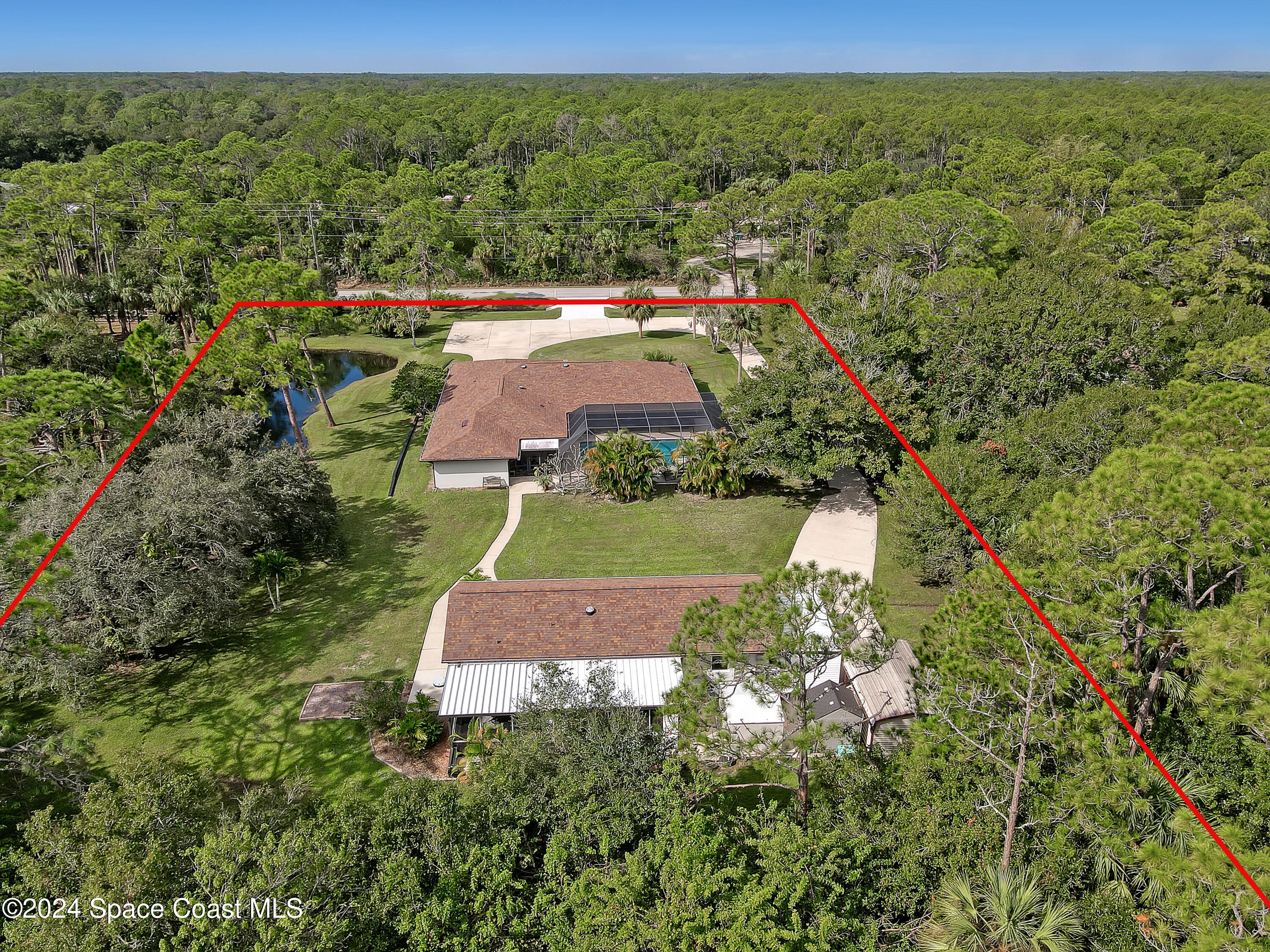 3865 Corey Road Malabar, FL 32950 - Photo 72 of 72 an aerial view of residential houses with outdoor space and trees