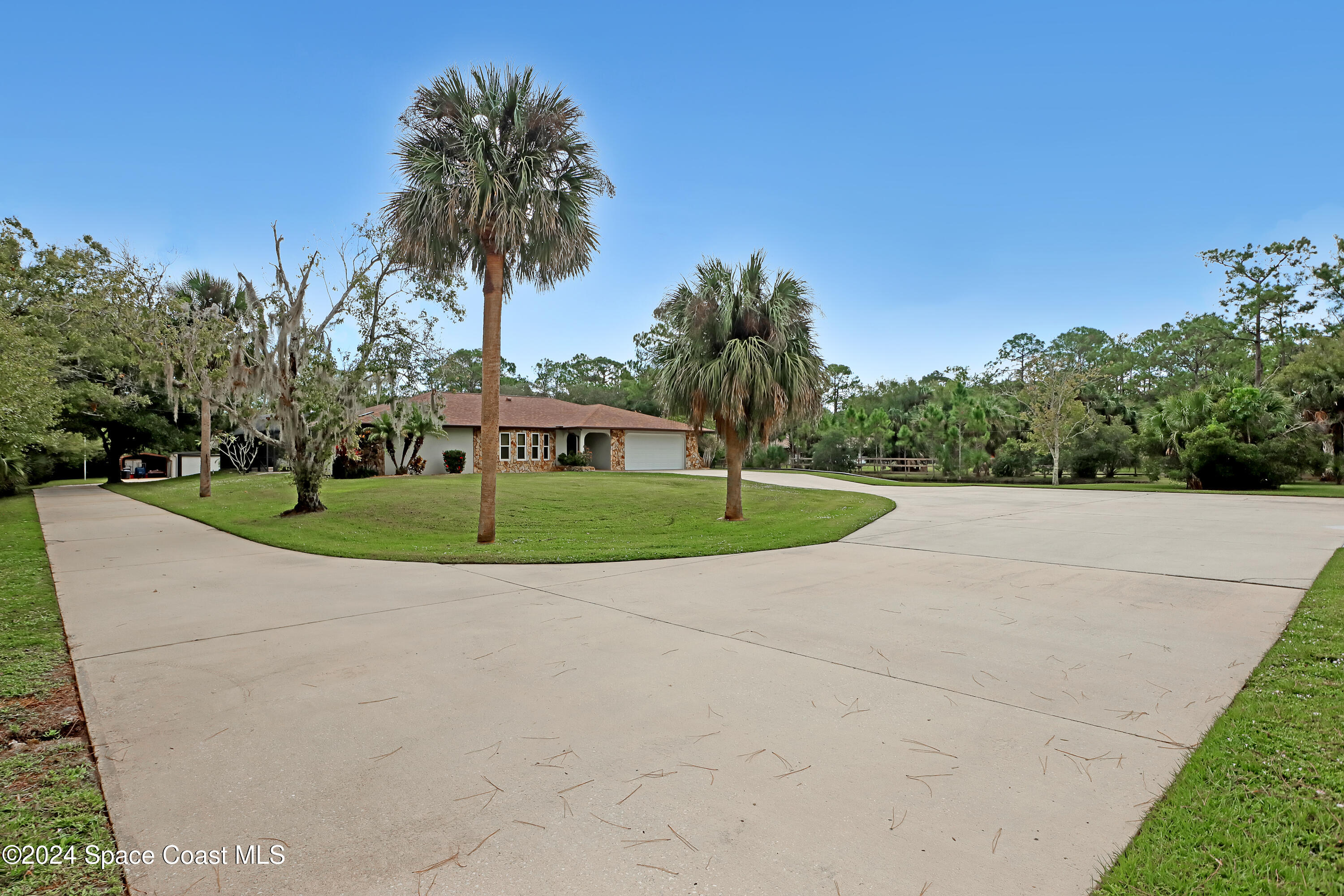 3865 Corey Road Malabar, FL 32950 - Photo 10 of 72 a view of a park with palm trees