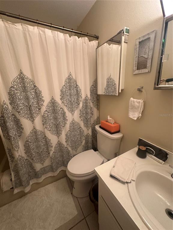 8440 Old Post Road, Unit 202 Port Richey, FL 34668 - Photo 8 of 17 a bathroom with a toilet and a sink