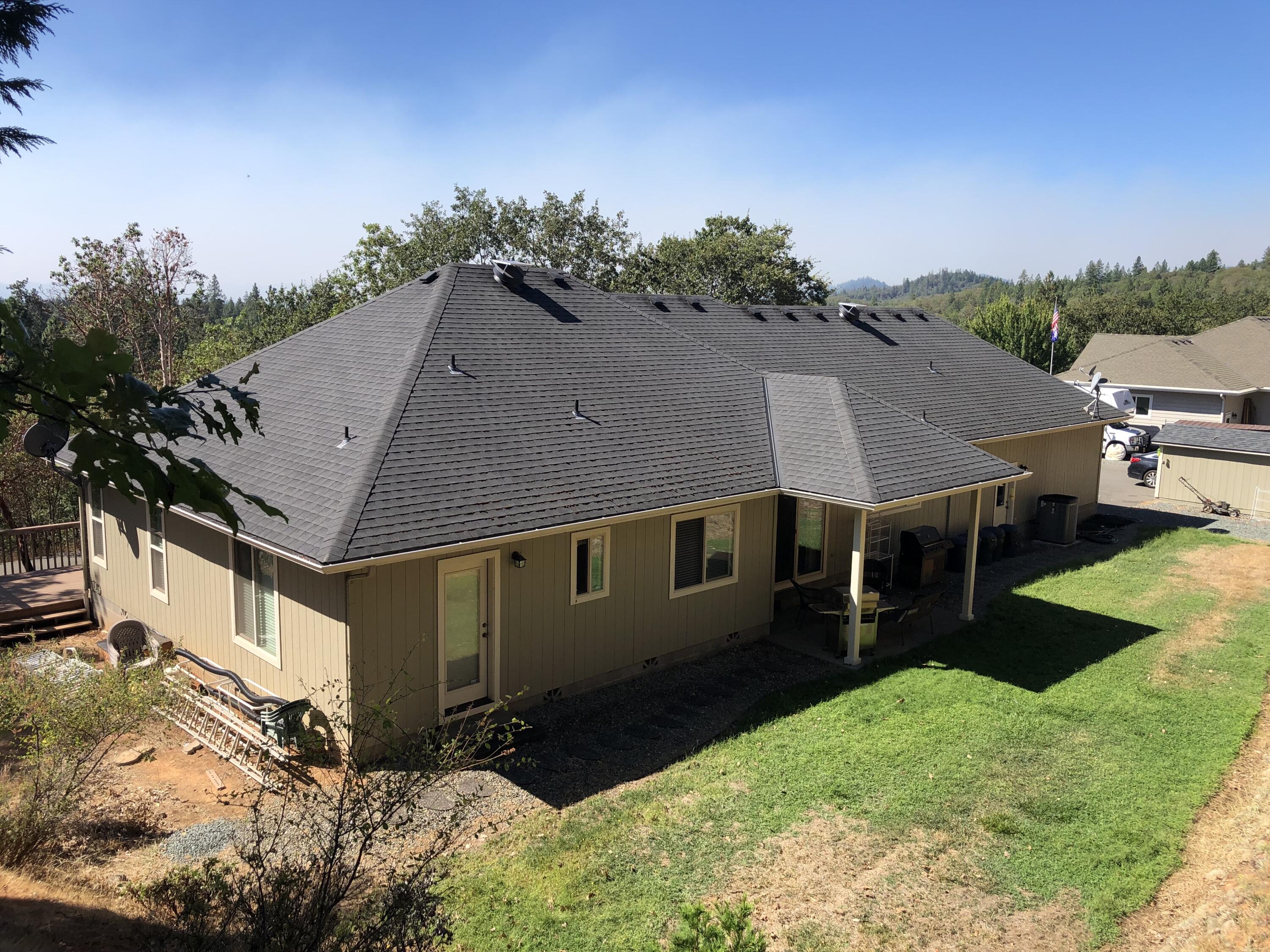 705 Three Pines Road Grants Pass, OR 97526 - Photo 12 of 47 an aerial view of a house with a yard