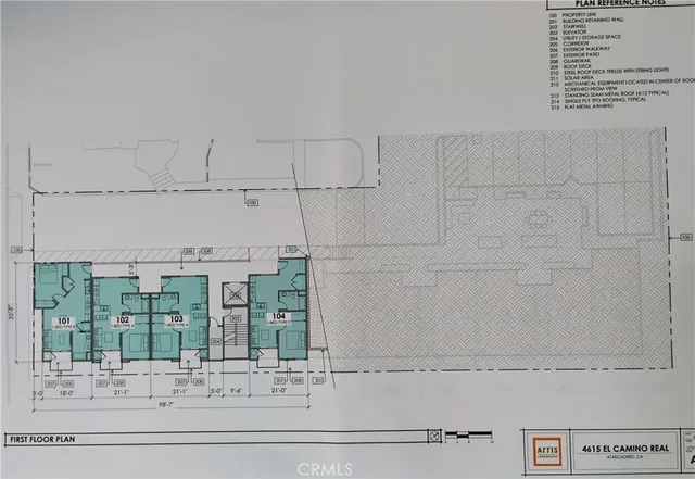 a living room with kitchen