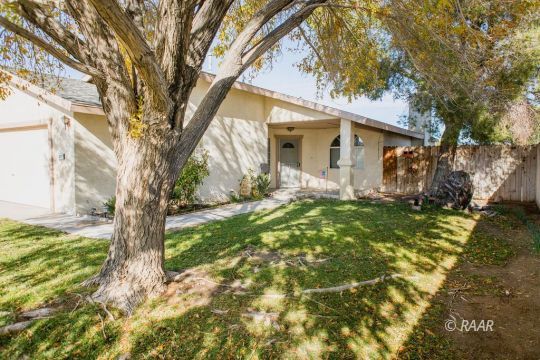 1112 Lee Avenue Ridgecrest, CA 93555 - Photo 3 of 29 a front view of a house with garden