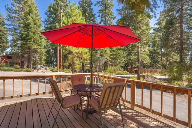 a view of balcony with outdoor seating and wooden floor