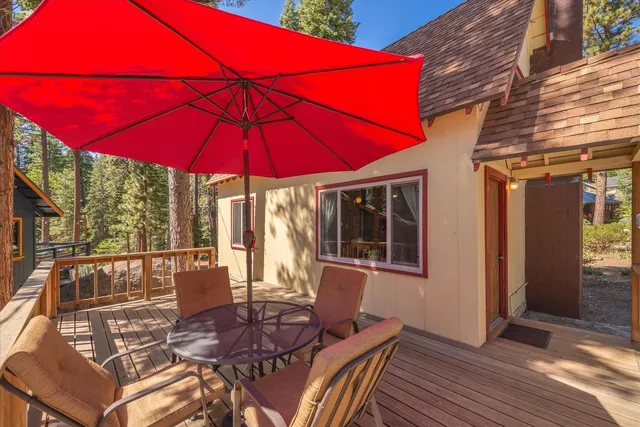 a view of a house with backyard porch and sitting area