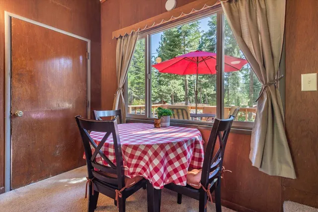 a dining room with furniture and yard