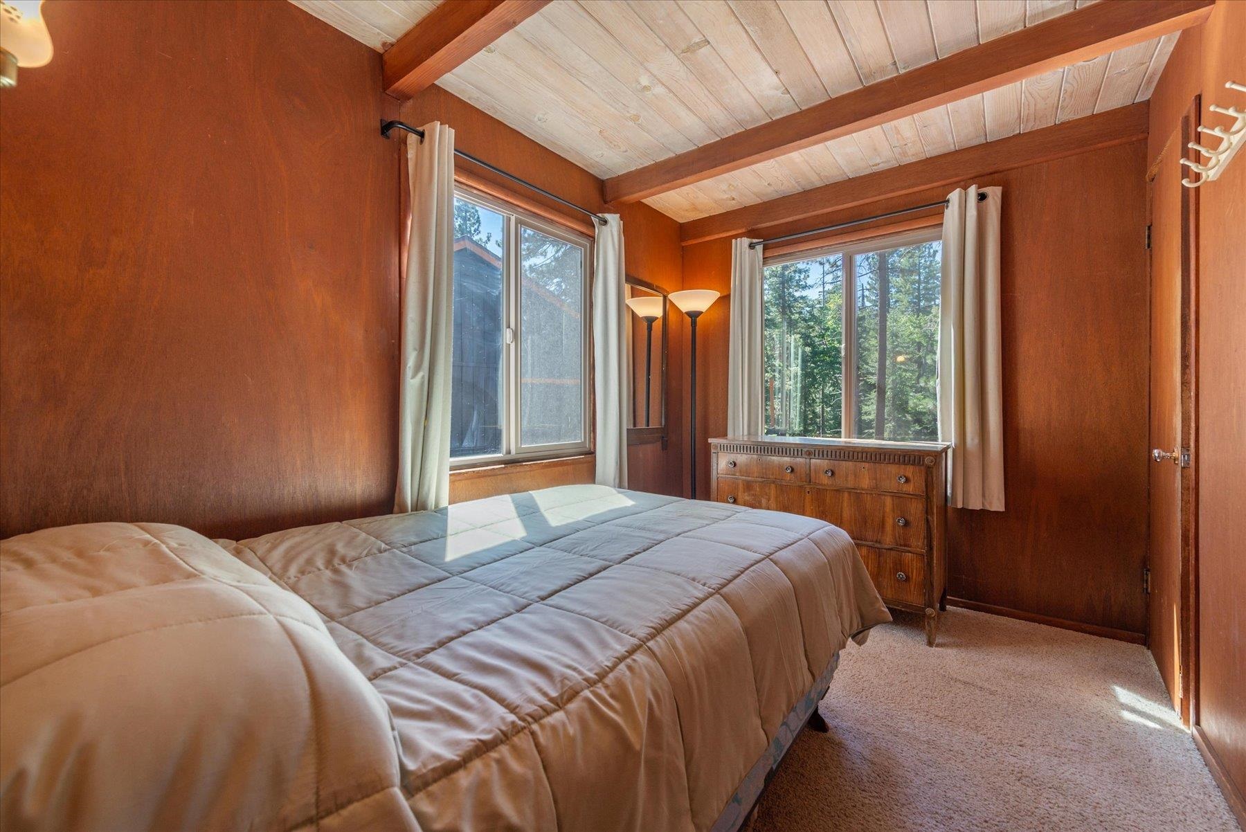265 Old County Road Carnelian Bay, CA 96140 - Photo 20 of 28 a bedroom with a bed and a window