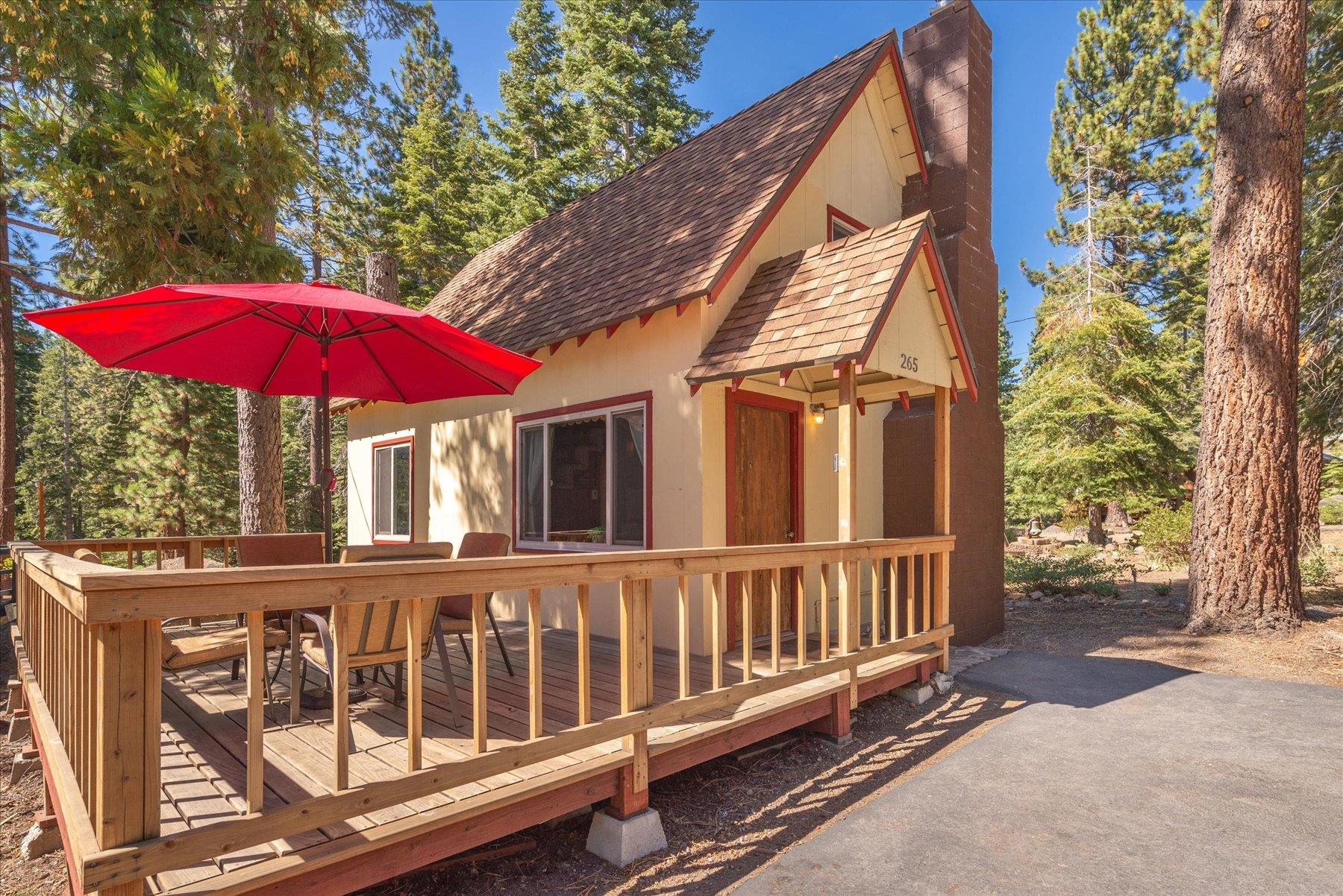 265 Old County Road Carnelian Bay, CA 96140 - Photo 6 of 28 a view of a house with a yard and furniture