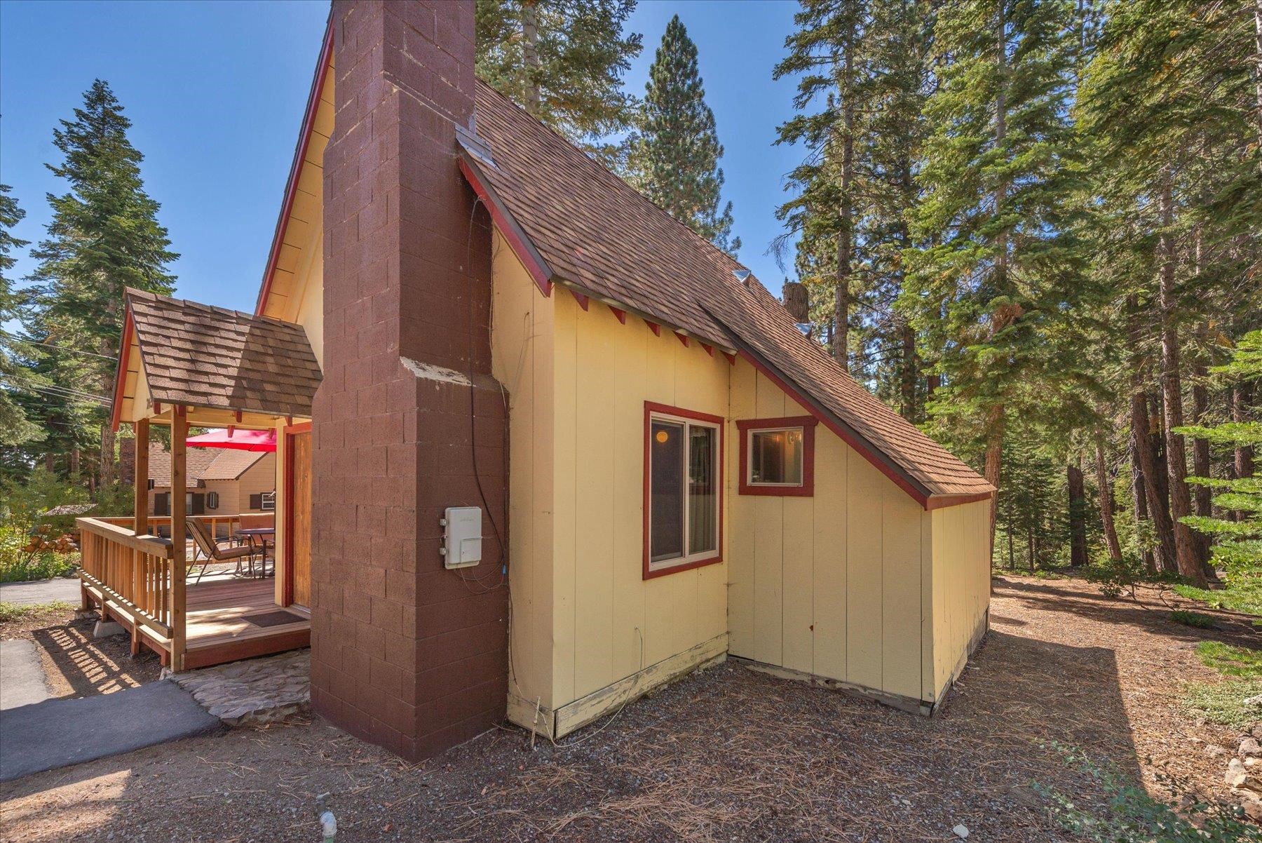 265 Old County Road Carnelian Bay, CA 96140 - Photo 8 of 28 a view of a small house with a tree