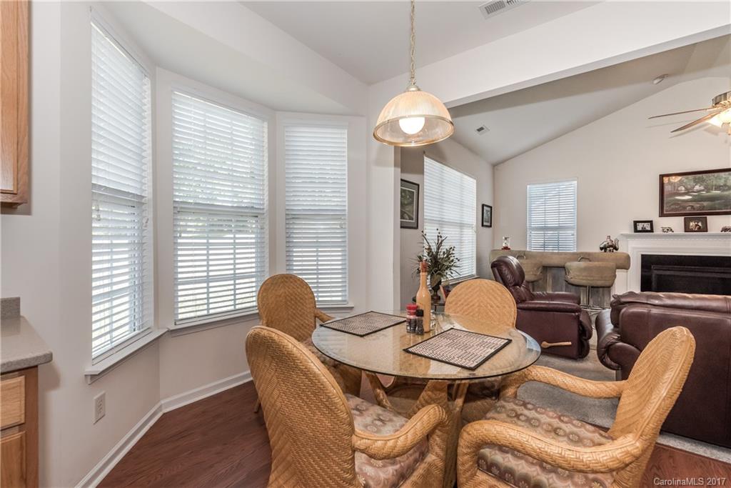 242 Garnet Court Fort Mill, SC 29708 - Photo 12 of 22 a view of a dining room with furniture and a large window