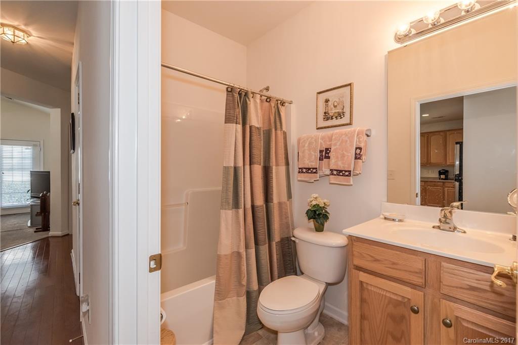 242 Garnet Court Fort Mill, SC 29708 - Photo 13 of 22 a bathroom with a sink a toilet a mirror and shower