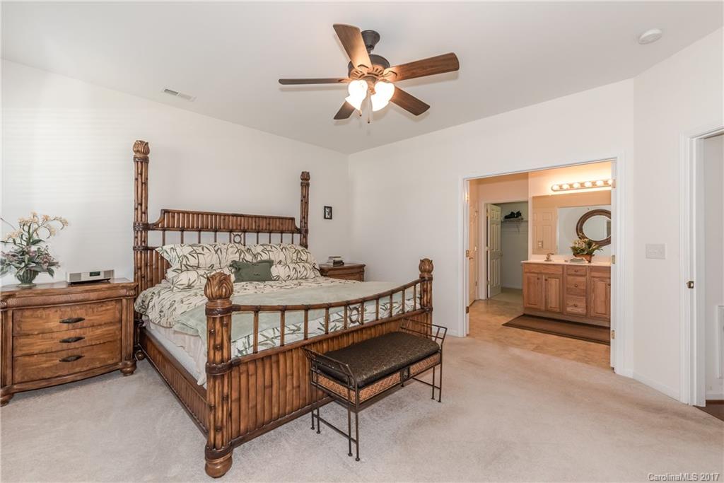 242 Garnet Court Fort Mill, SC 29708 - Photo 16 of 22 a bed room with a bed and a ceiling fan