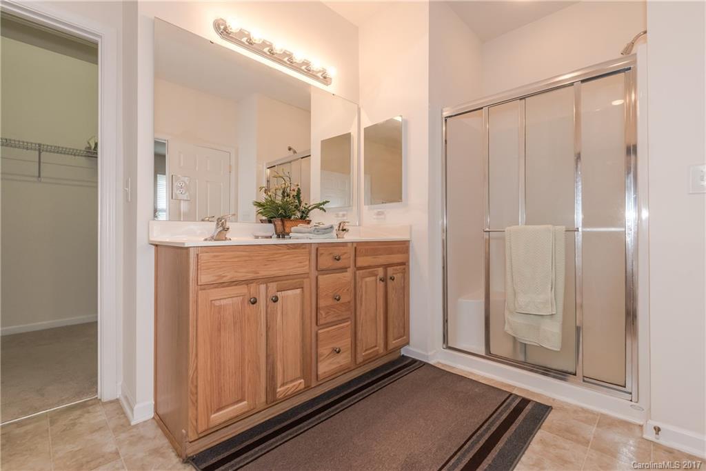 242 Garnet Court Fort Mill, SC 29708 - Photo 18 of 22 a view of a bathroom with mirror