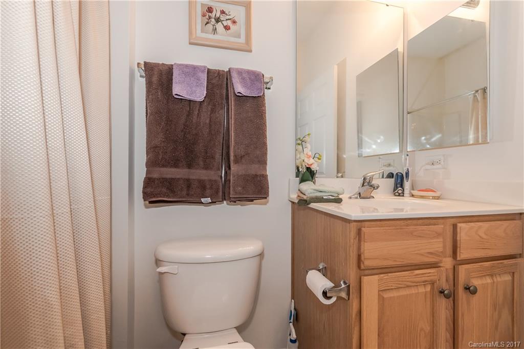 242 Garnet Court Fort Mill, SC 29708 - Photo 20 of 22 a bathroom with a granite countertop sink toilet and shower