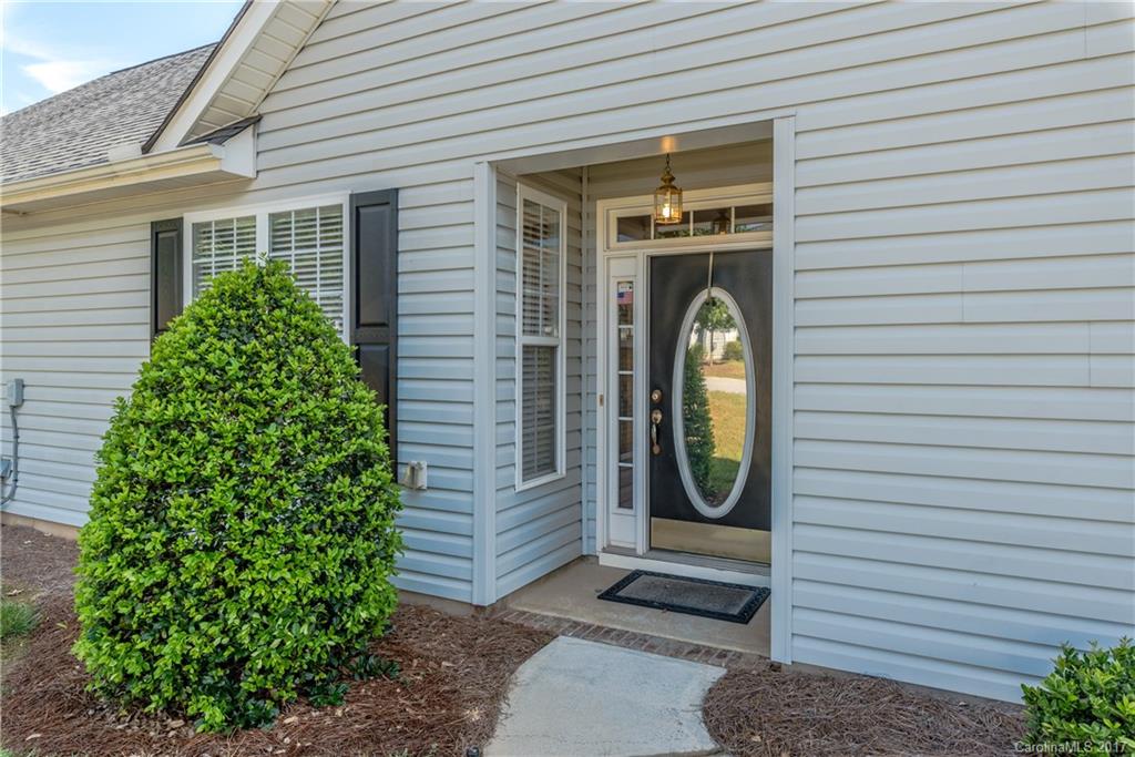 242 Garnet Court Fort Mill, SC 29708 - Photo 3 of 22 a front view of a house with garden