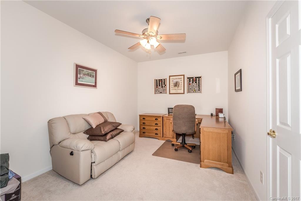 242 Garnet Court Fort Mill, SC 29708 - Photo 7 of 22 a living room with furniture and a ceiling fan