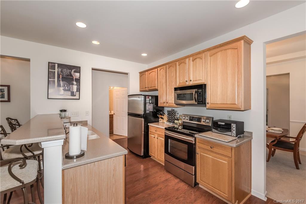 242 Garnet Court Fort Mill, SC 29708 - Photo 8 of 22 a kitchen with stainless steel appliances granite countertop a refrigerator stove top oven a sink and dishwasher