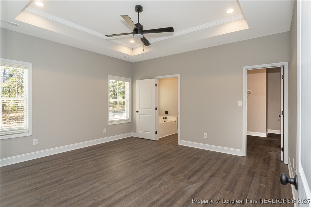 229 August Lane Raeford, NC 28376 - Photo 15 of 39 a view of an empty room with wooden floor and a window