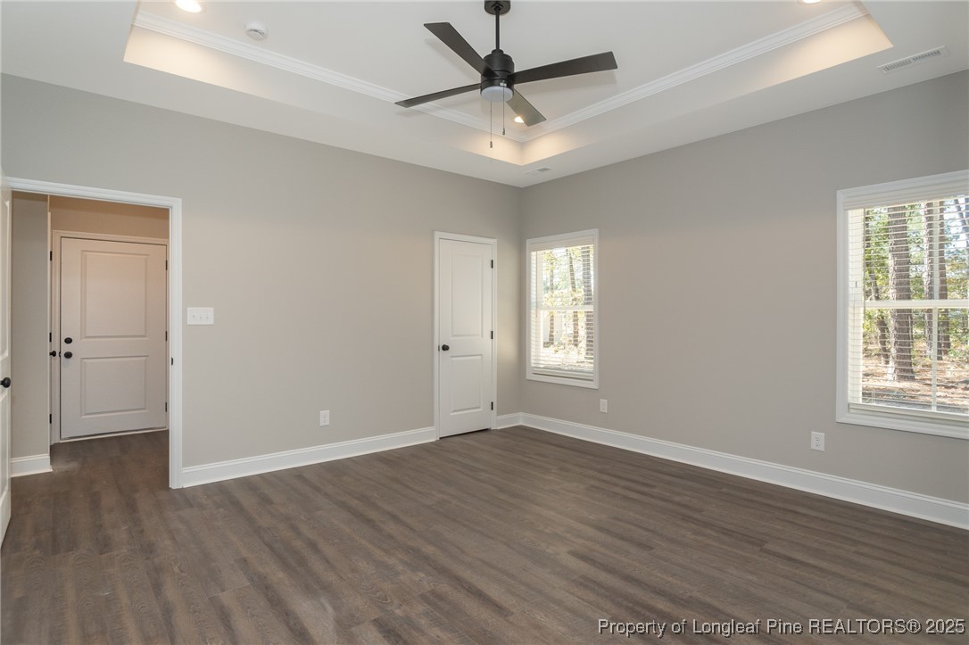229 August Lane Raeford, NC 28376 - Photo 16 of 39 wooden floor in an empty room with a window