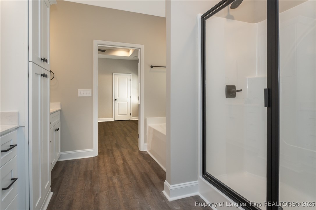 229 August Lane Raeford, NC 28376 - Photo 19 of 39 a view of a hallway with wooden floor