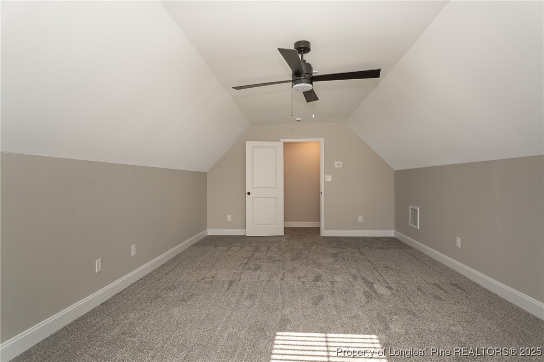229 August Lane Raeford, NC 28376 - Photo 32 of 39 a view of a livingroom with a ceiling fan and window