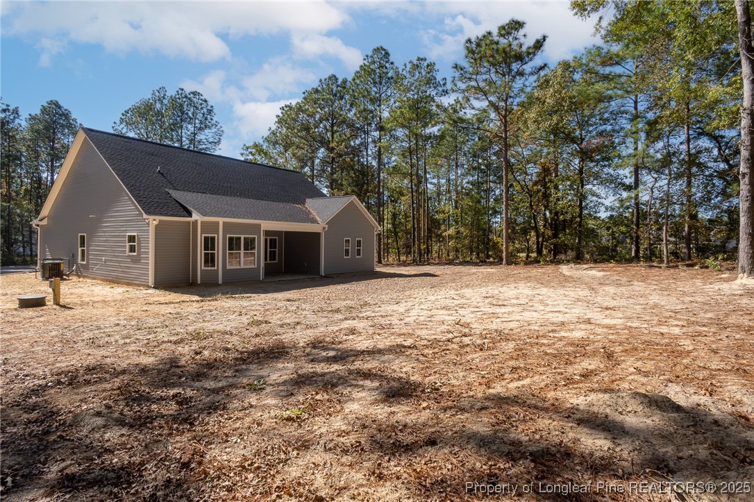 229 August Lane Raeford, NC 28376 - Photo 37 of 39 a house with trees in the background