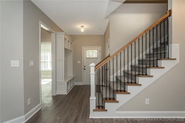 a view of staircase with wooden floor and stairs