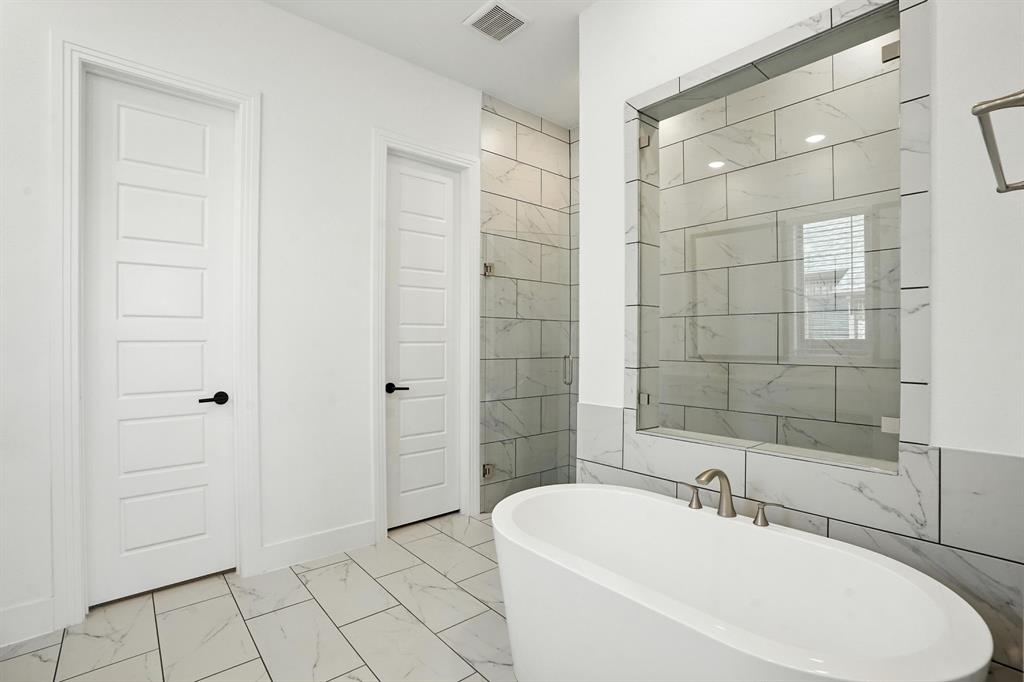 4621 Mount Vista Road Oak Point, TX 75068 - Photo 21 of 40 a bathroom with a sink a toilet and shower