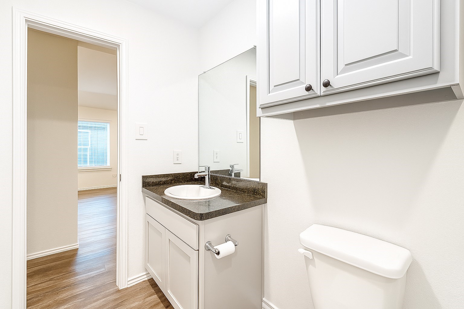 5611 Simcrest Grove Drive Spring, TX 77373 - Photo 12 of 18 a bathroom with a sink and a toilet