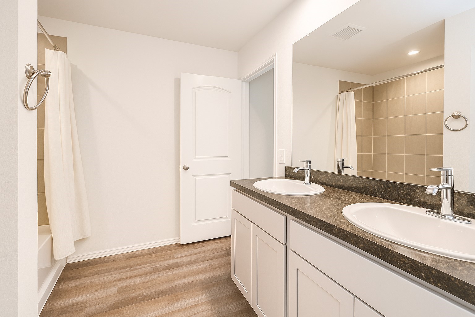 5611 Simcrest Grove Drive Spring, TX 77373 - Photo 6 of 18 a bathroom with a granite countertop sink and a mirror
