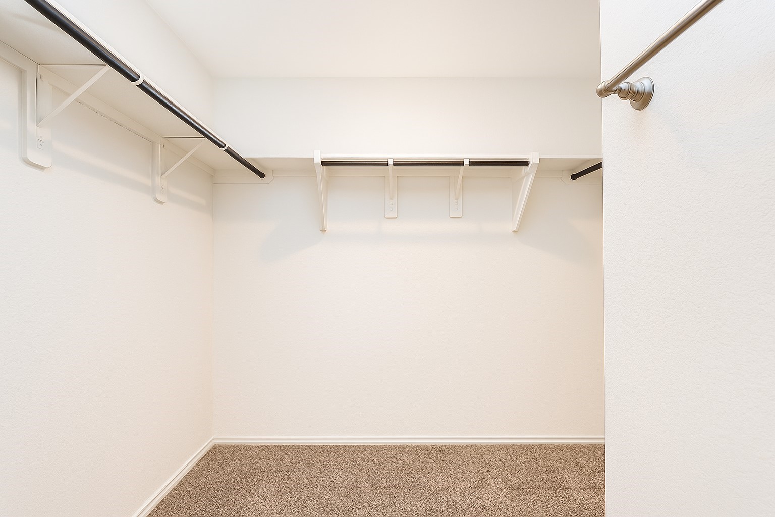 5611 Simcrest Grove Drive Spring, TX 77373 - Photo 7 of 18 a view of walk in closet with empty racks