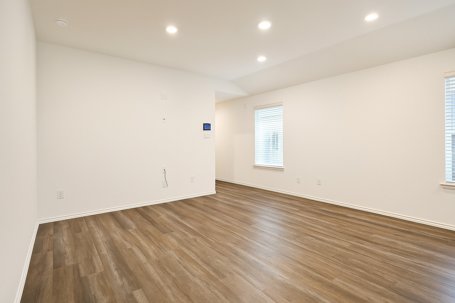 5611 Simcrest Grove Drive Spring, TX 77373 - Photo 10 of 18 an empty room with wooden floor and windows