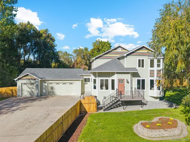 a house view with a swimming pool and fire pit