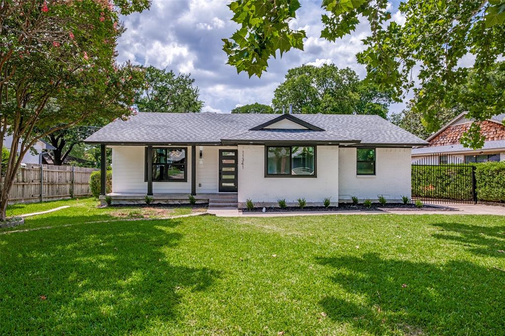 11341 Gatewood Place Dallas, TX 75218 - Photo 1 of 29 a front view of a house with a garden and trees