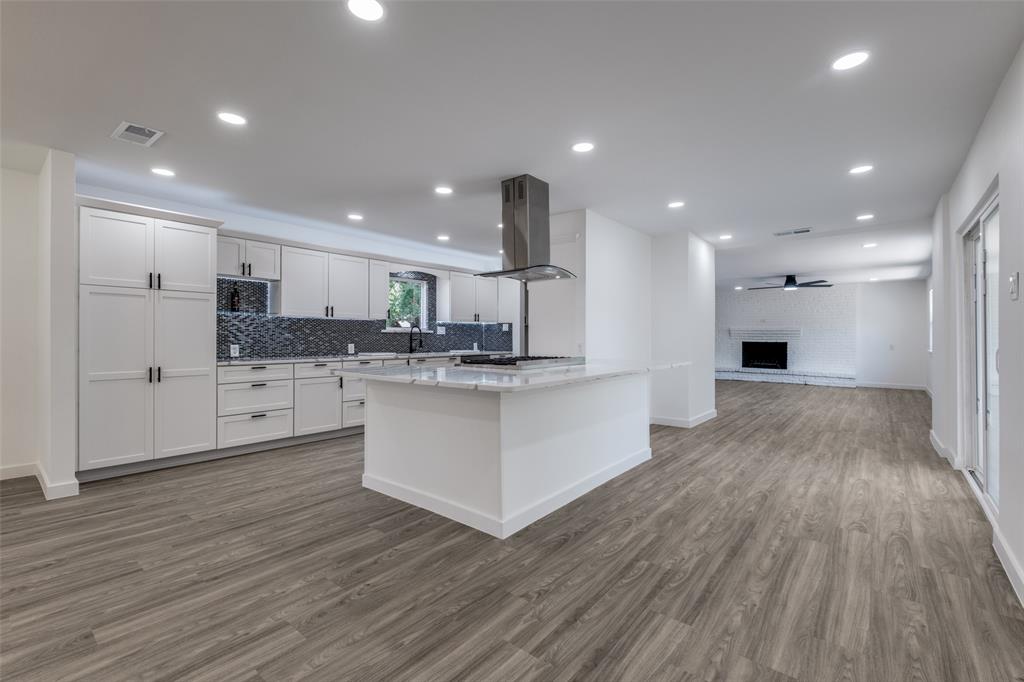 11341 Gatewood Place Dallas, TX 75218 - Photo 12 of 29 a large kitchen with stainless steel appliances granite countertop a large counter top a sink and a refrigerator