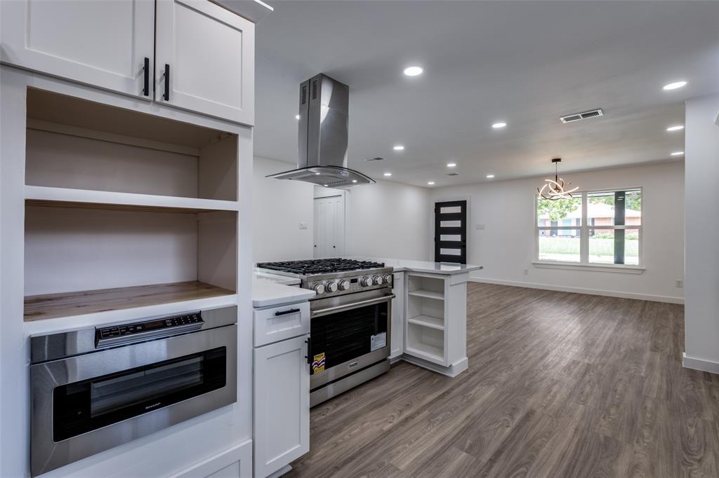 11341 Gatewood Place Dallas, TX 75218 - Photo 13 of 29 a kitchen with a stove and a wooden floors