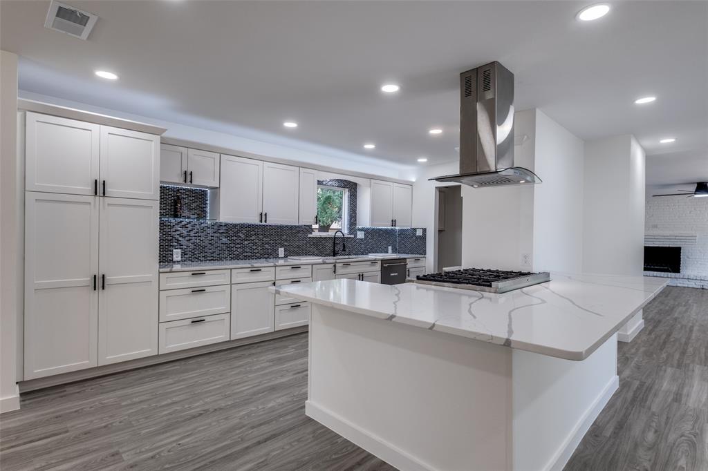 11341 Gatewood Place Dallas, TX 75218 - Photo 14 of 29 a kitchen with stainless steel appliances granite countertop a sink a stove and a refrigerator