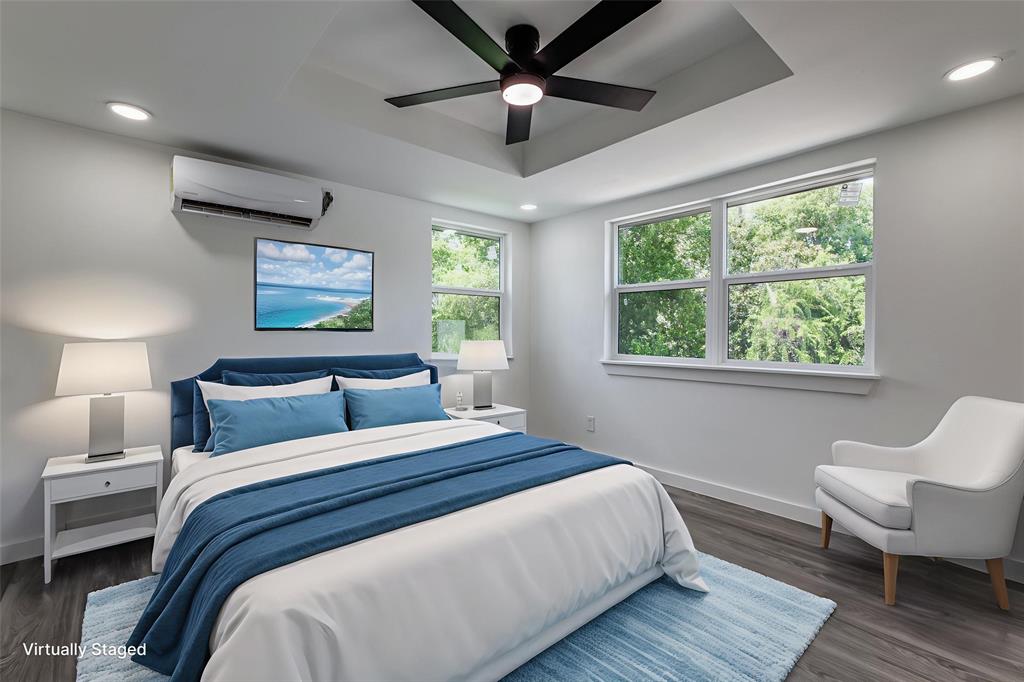 11341 Gatewood Place Dallas, TX 75218 - Photo 19 of 29 a bedroom with a large bed chandelier and a window