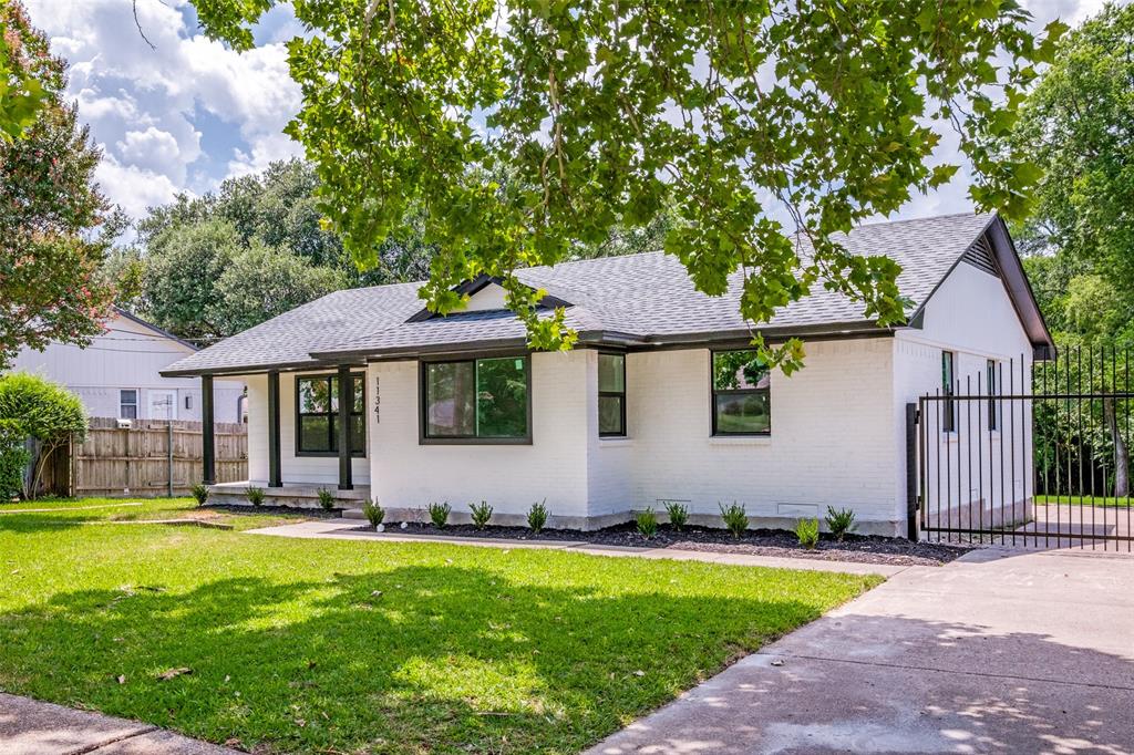 11341 Gatewood Place Dallas, TX 75218 - Photo 2 of 29 a front view of a house with a yard