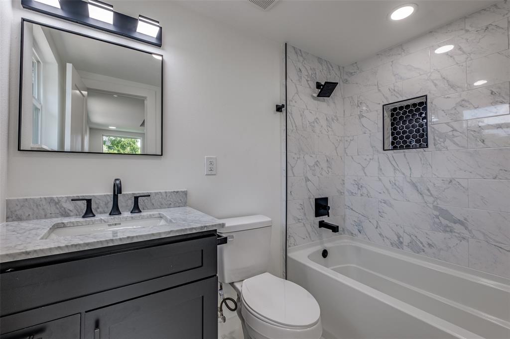 11341 Gatewood Place Dallas, TX 75218 - Photo 21 of 29 a bathroom with a granite countertop sink toilet and shower